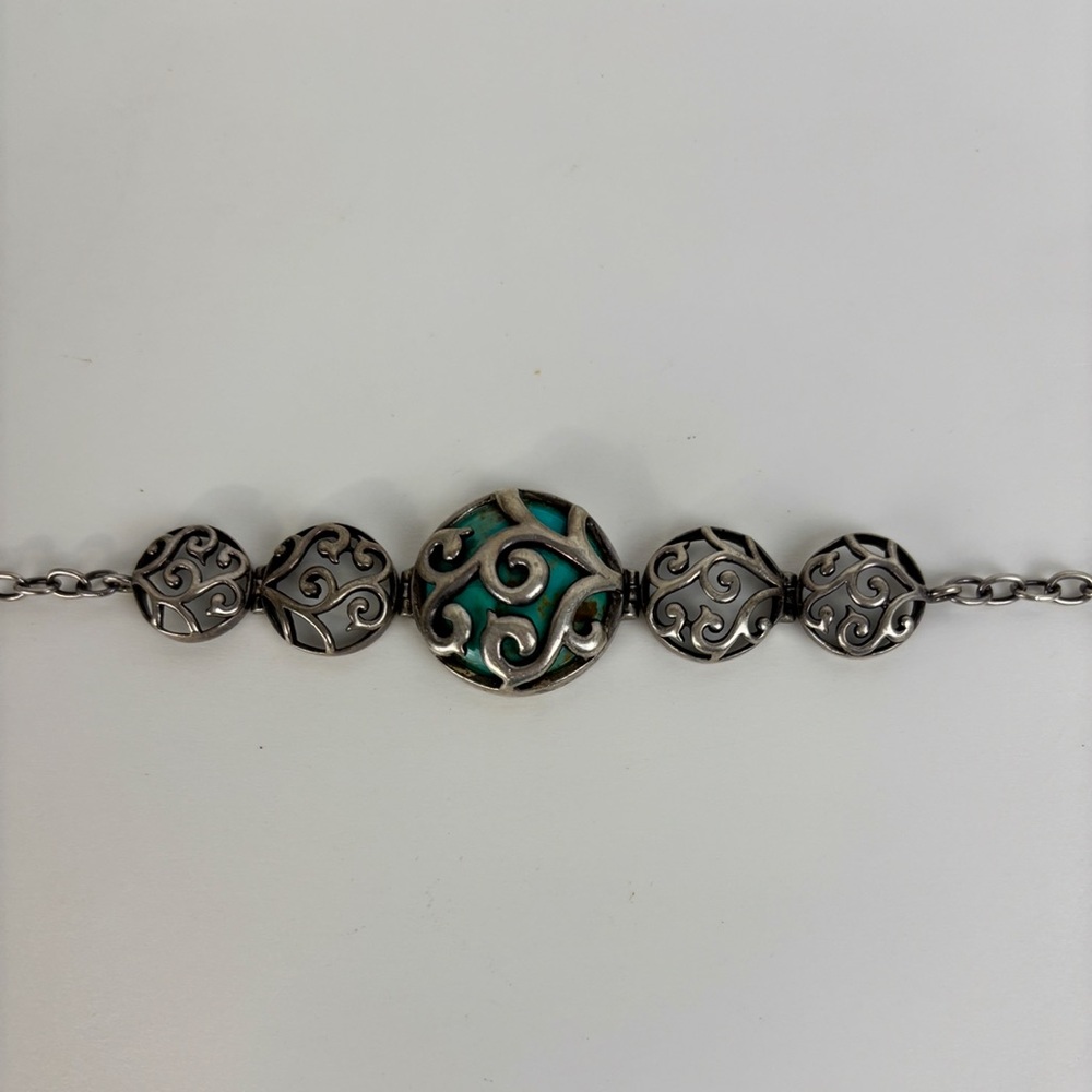 Vintage silver-tone bracelet with filigree links & turquoise centerpiece, toggle